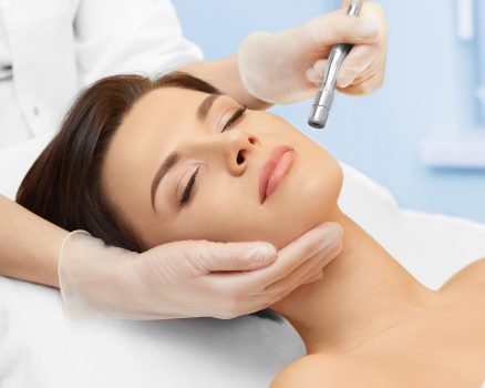 Hardware cosmetology. Spa clinic. Beautiful woman at skin treatment procedure. Microdermabrasion. Young healthy skin. Facial exfoliating. Skin rejuvenation. Beauty treatment. Cosmetology.