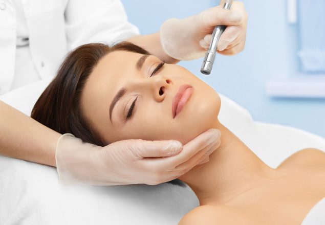 Hardware cosmetology. Spa clinic. Beautiful woman at skin treatment procedure. Microdermabrasion. Young healthy skin. Facial exfoliating. Skin rejuvenation. Beauty treatment. Cosmetology.